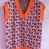 Тепла яскрава жилетка