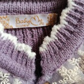 В'язаний теплий комбінезон,дуже нарядний. На 9-12 місяців.