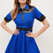 Бандажна сукня в розмірі S із шкіряними вставками.