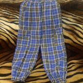 Клеві картаті штанці з карманами на дівчинку